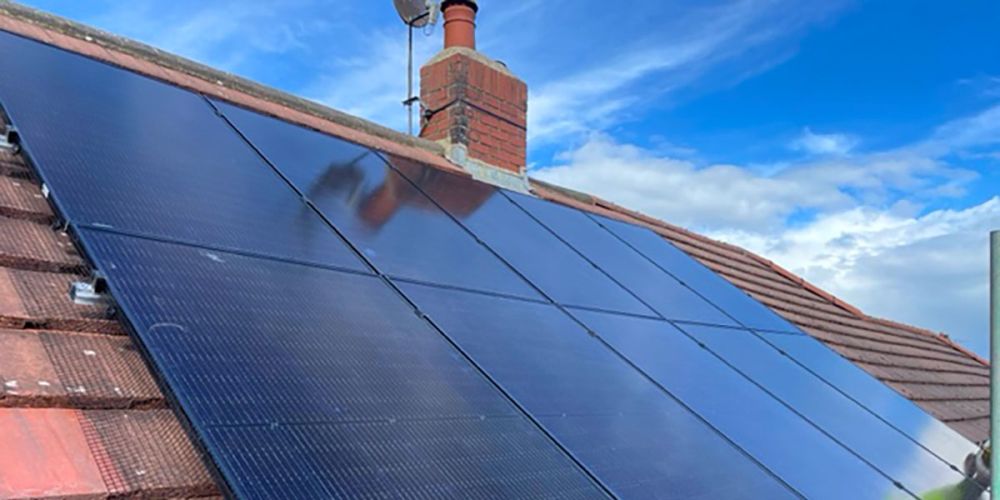 All black solar panels installed on a house in Yeadon with pidgeon guard around the panels